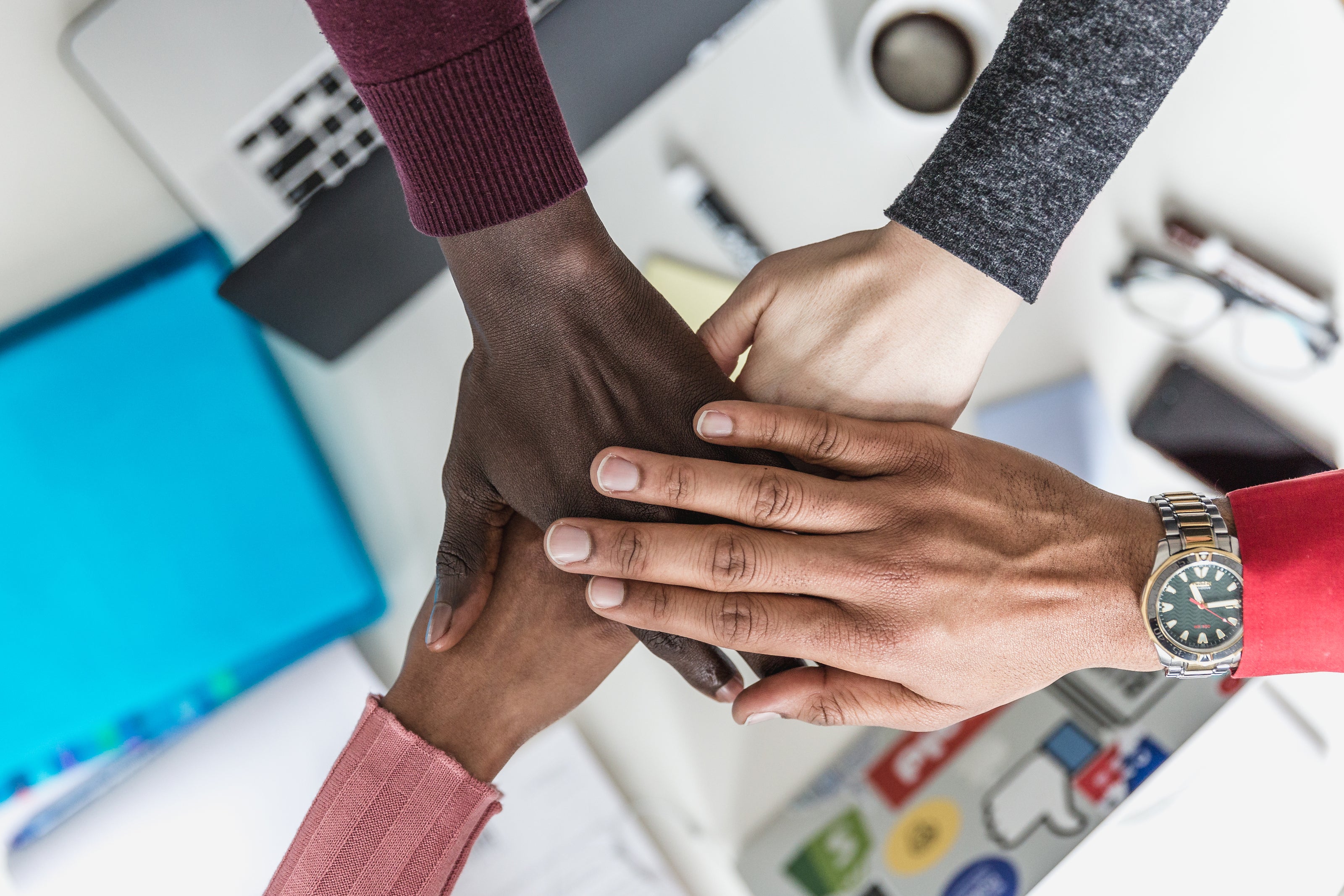 diverse hands meeting